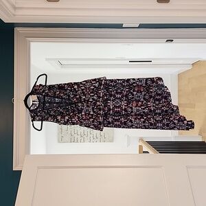 Beautiful asymmetrical dress with pleats, lace, and midi length. Worn once.